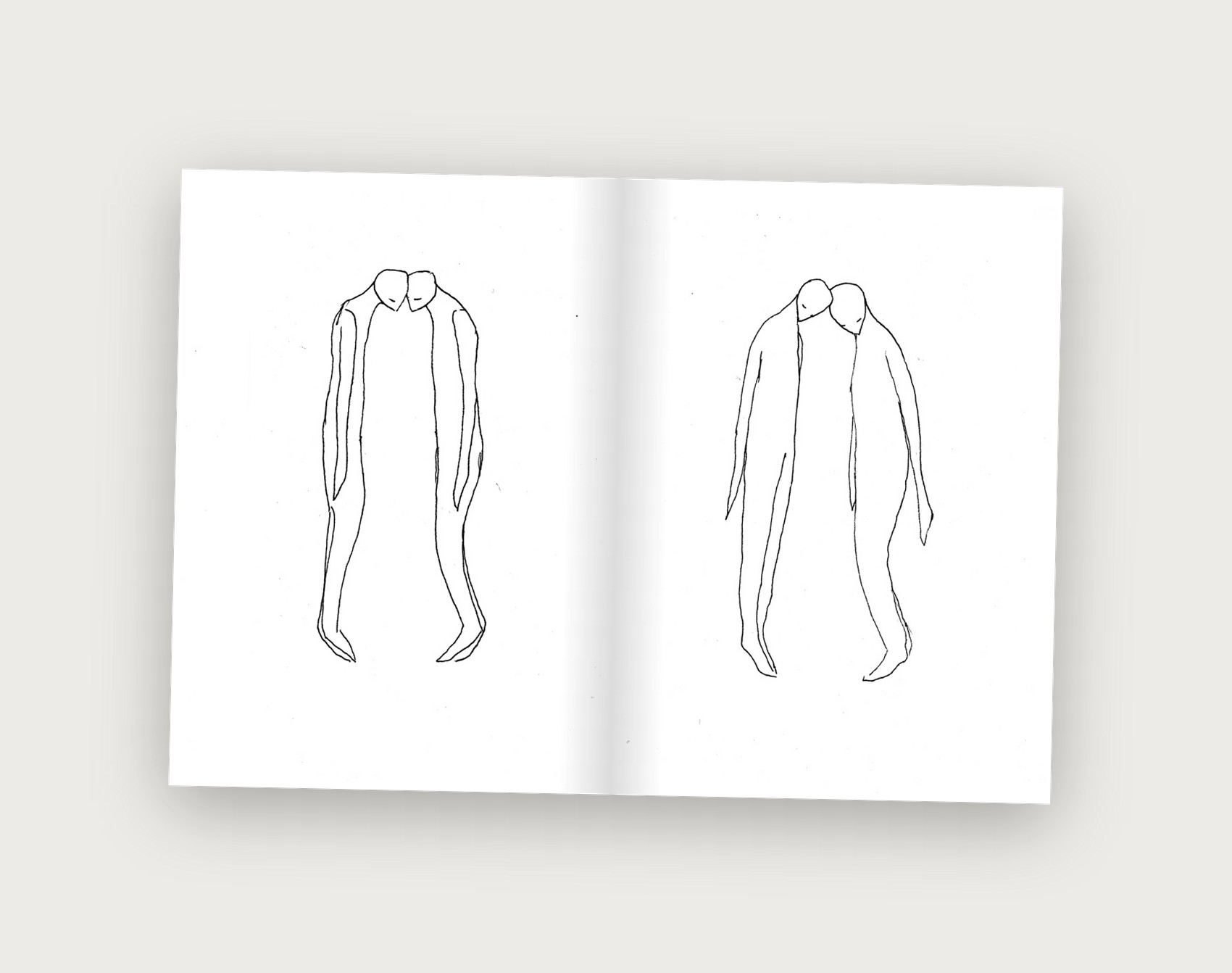 Dichotomy zine spread showing two merged figures, heads bowed together